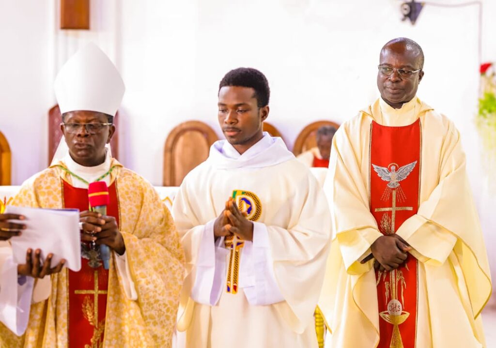 Bishop Simon and priests after thanksgiving mass at ucc